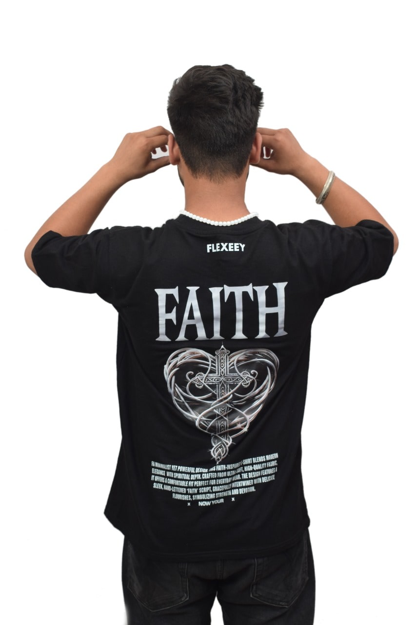 A man wearing a black crew neck t-shirt with a graphic on the back that reads 'FAITH' stylized with a heart and cross elements.